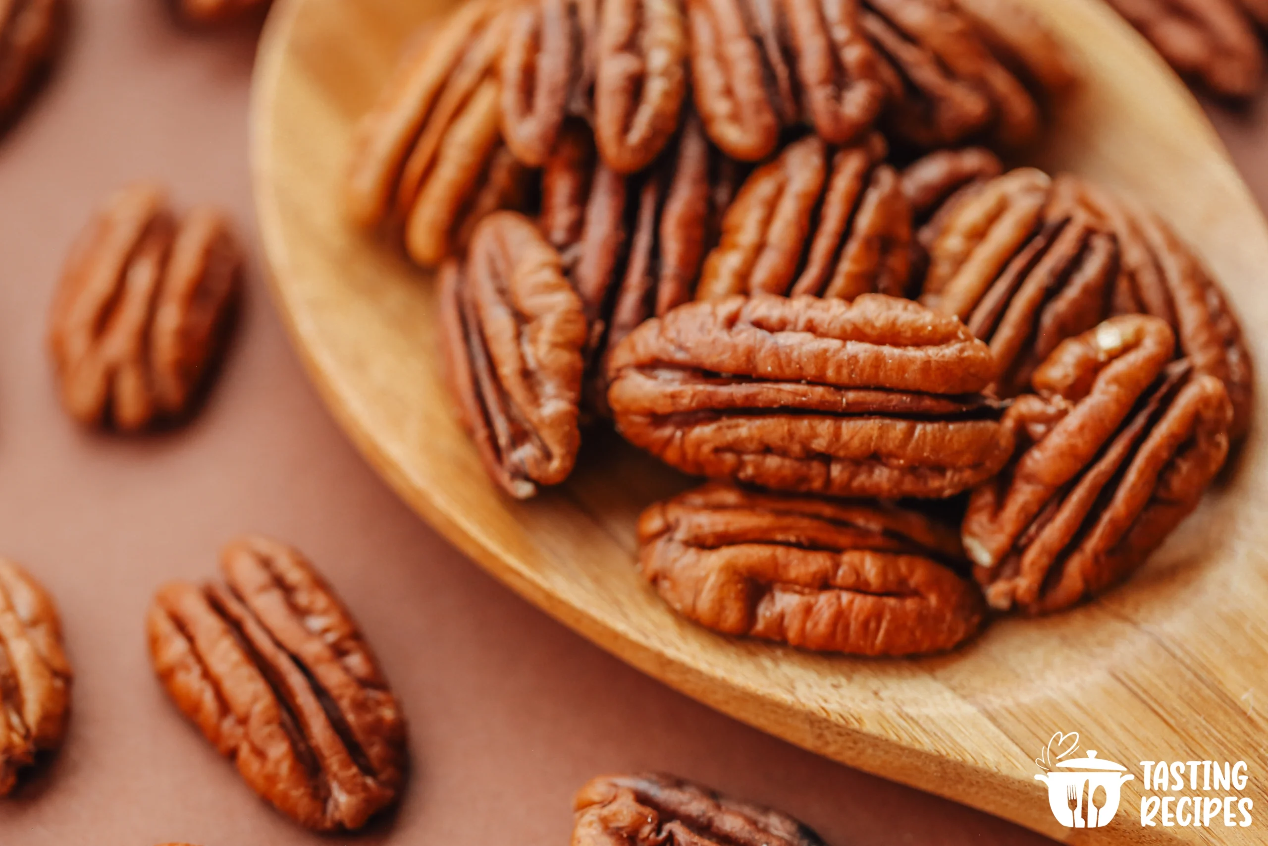 Sweet and spicy keto pecans on a baking sheet