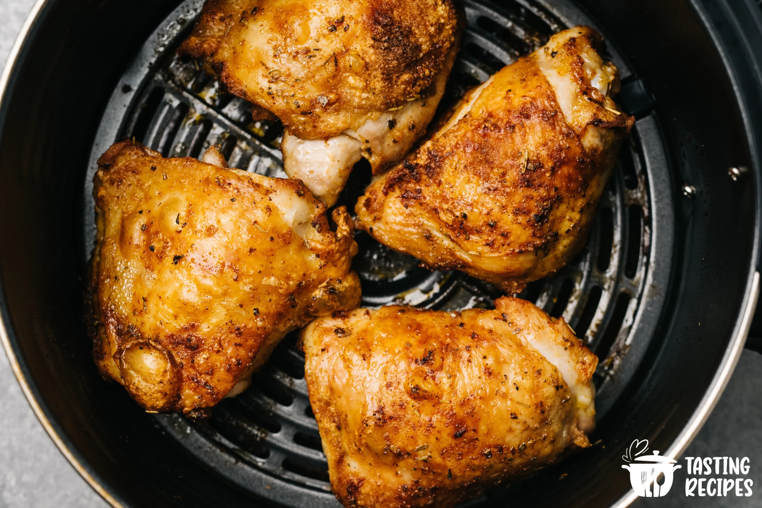 Frozen chicken breast cooked in an air fryer with a crispy golden crust