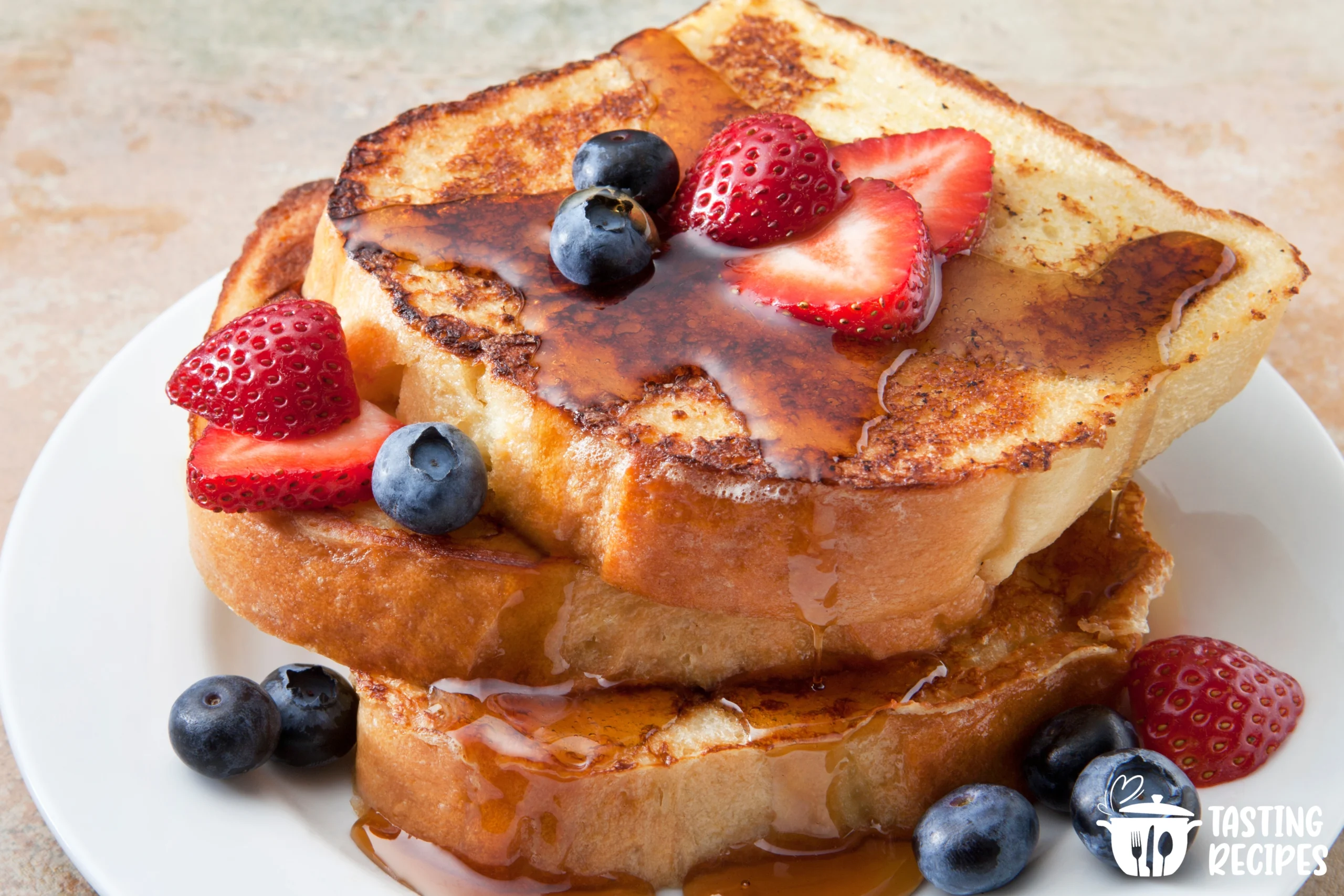 Sourdough French toast served with fresh berries and maple syrup