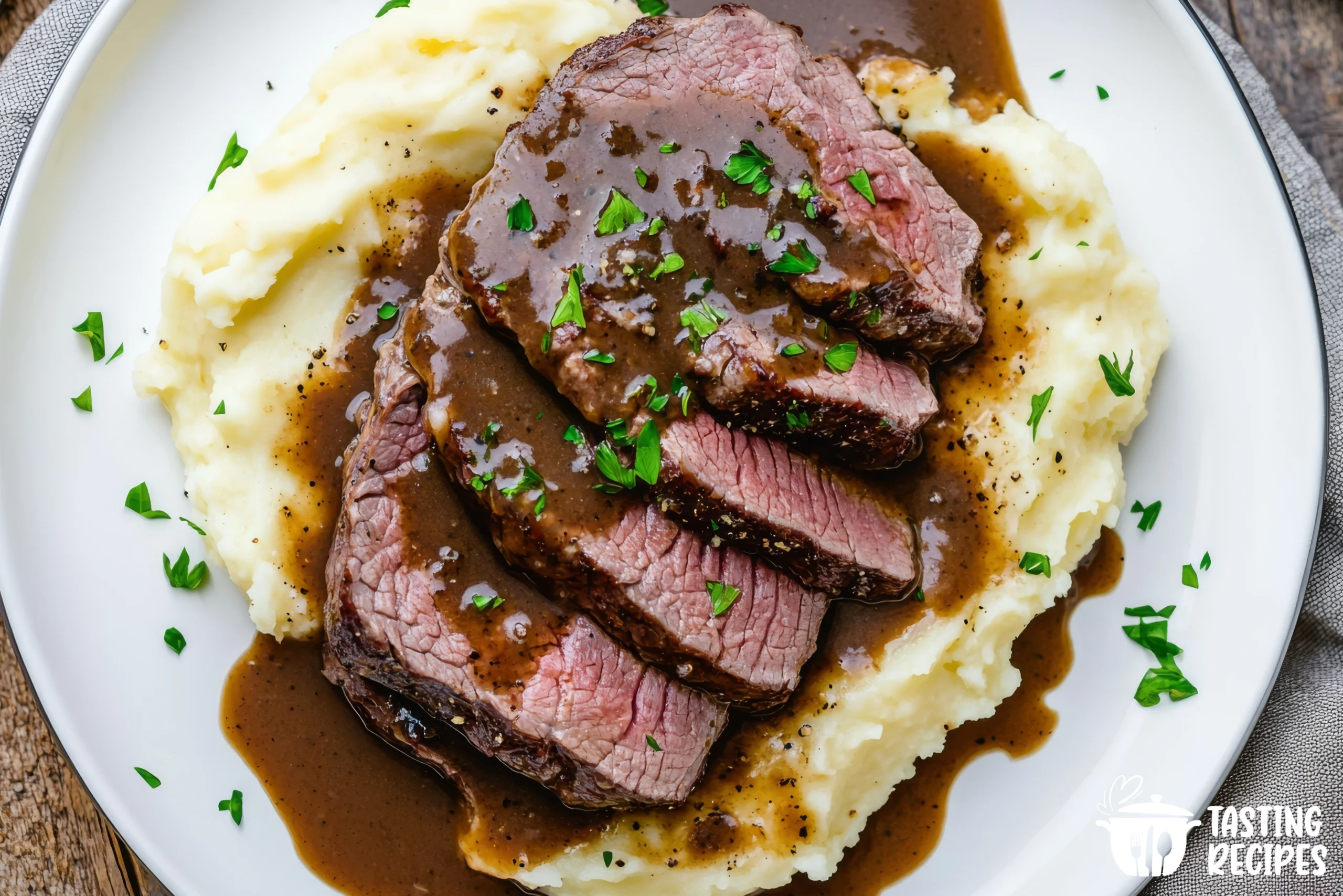 Juicy steak served with creamy mashed potatoes on a plate